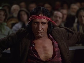 Movie still from “The Adventures of Tom Sawyer” (1938), directed by Norman Taurog – A man with a red bandanna around his neck; Close Up shot, Over the shoulder angle