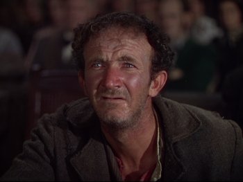 Movie still from “The Adventures of Tom Sawyer” (1938), directed by Norman Taurog – An old man with a beard is sitting in a room; Close Up shot, Low angle
