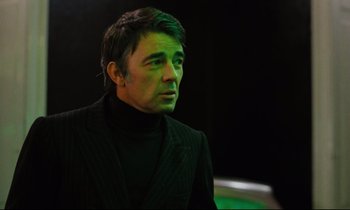 Movie still from “The American Friend” (1977), directed by Wim Wenders – A man in a black jacket and a black shirt; Close Up shot, Low angle