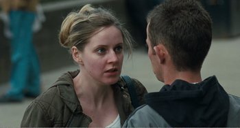 Movie still from “The Angels' Share” (2012), directed by Ken Loach – A young woman talking to a young man on the street; Close Up shot, Over the shoulder angle