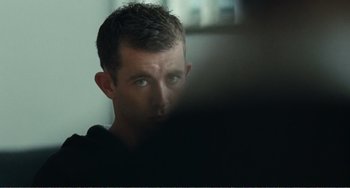 Movie still from “The Angels' Share” (2012), directed by Ken Loach – A person looking at a computer screen; Close Up shot, Over the shoulder angle