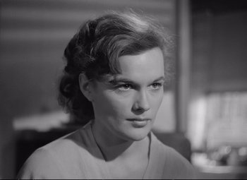 Movie still from “The Asphalt Jungle” (1950), directed by John Huston – Black and white photograph of a woman looking at the camera; Close Up shot, High angle