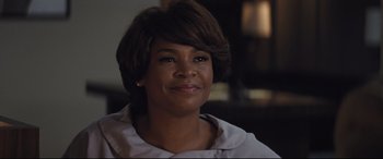 Movie still from “The Banker” (2020), directed by George Nolfi – A person wearing a white shirt; Close Up shot, Over the shoulder angle