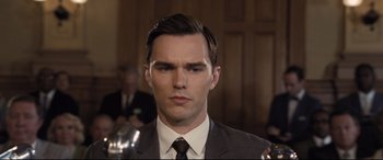 Movie still from “The Banker” (2020), directed by George Nolfi – A person wearing a suit and tie; Close Up shot, Low angle