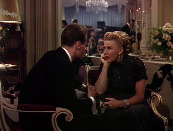 Movie still from “The Barkleys of Broadway” (1949), directed by Charles Walters – A man and a woman sitting at a dinner table; Medium shot, Over the shoulder angle