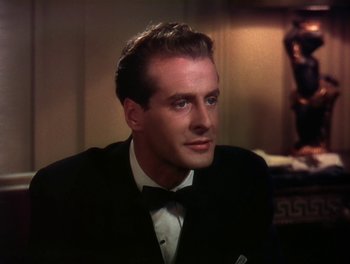 Movie still from “The Barkleys of Broadway” (1949), directed by Charles Walters – A person wearing a suit and a bow tie; Close Up shot, Over the shoulder angle