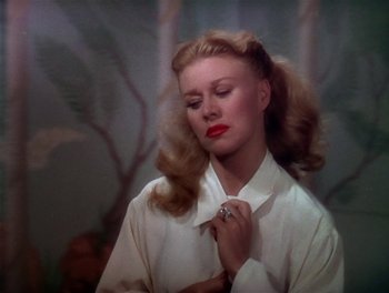 Movie still from “The Barkleys of Broadway” (1949), directed by Charles Walters – A beautiful woman with long blonde hair and red lipstick; Close Up shot, Low angle