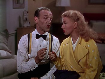Movie still from “The Barkleys of Broadway” (1949), directed by Charles Walters – A man and a woman are talking to each other; Medium shot, Low angle