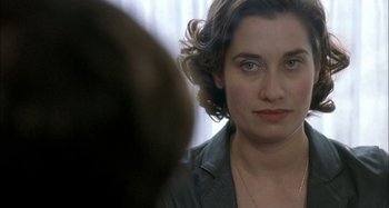 Movie still from “The Beat That My Heart Skipped” (2005), directed by Jacques Audiard – A person looking at the camera; Close Up shot, Over the shoulder angle
