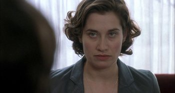 Movie still from “The Beat That My Heart Skipped” (2005), directed by Jacques Audiard – A person with short hair; Close Up shot, Over the shoulder angle