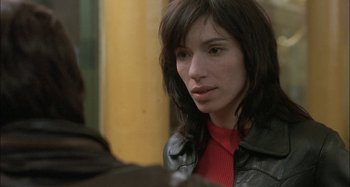 Movie still from “The Beat That My Heart Skipped” (2005), directed by Jacques Audiard – A woman in a red shirt and a black leather jacket; Close Up shot, Over the shoulder angle