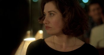 Movie still from “The Beat That My Heart Skipped” (2005), directed by Jacques Audiard – A person wearing a black shirt; Close Up shot, Over the shoulder angle