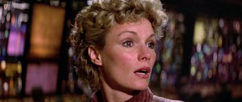 Movie still from “The Black Hole” (1979), directed by Gary Nelson – A person with curly blonde hair; Close Up shot, Low angle