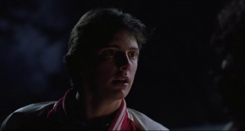 Movie still from “The Blob” (1988), directed by Chuck Russell – A young man is looking into the distance; Close Up shot, Low angle