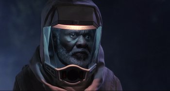 Movie still from “The Blob” (1988), directed by Chuck Russell – A man with a gas mask on his face; Close Up shot, High angle