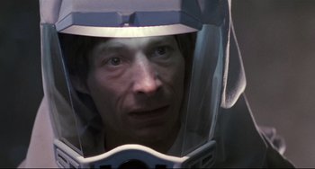 Movie still from “The Blob” (1988), directed by Chuck Russell – A person wearing a helmet; Close Up shot, High angle