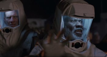 Movie still from “The Blob” (1988), directed by Chuck Russell – An image of an old man in a space suit; Close Up shot, Low angle