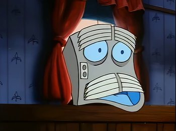 Movie still from “The Brave Little Toaster” (1987), directed by Jerry Rees – A computer monitor with a face on it in front of a window; Extreme Close Up shot, Low angle