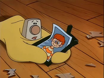 Movie still from “The Brave Little Toaster” (1987), directed by Jerry Rees – A picture of a person holding a phone in his hand; Extreme Close Up shot, High angle