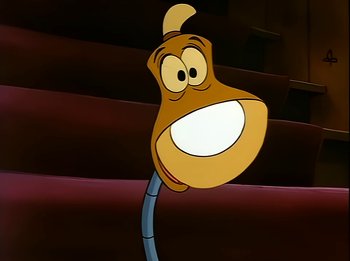 Movie still from “The Brave Little Toaster” (1987), directed by Jerry Rees – A goofy looking cartoon character with a big smile on his face; Extreme Close Up shot, Low angle