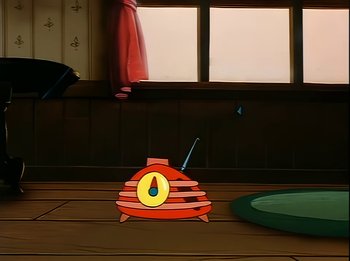 Movie still from “The Brave Little Toaster” (1987), directed by Jerry Rees – An animated picture of an orange and yellow clock; Extreme Wide shot, Low angle