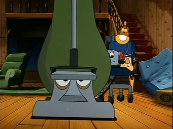 Movie still from “The Brave Little Toaster” (1987), directed by Jerry Rees – A cartoon of a man sitting in a chair next to a machine; Wide shot, Low angle
