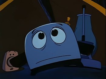 Movie still from “The Brave Little Toaster” (1987), directed by Jerry Rees – A cartoon of a toaster with a sad look on its face; Close Up shot, Low angle
