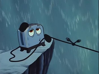 Movie still from “The Brave Little Toaster” (1987), directed by Jerry Rees – An animated toaster is being held up by a cord; Medium shot, Low angle