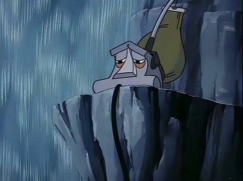 Movie still from “The Brave Little Toaster” (1987), directed by Jerry Rees – A cartoon of a man sitting on top of a cliff; Wide shot, Low angle