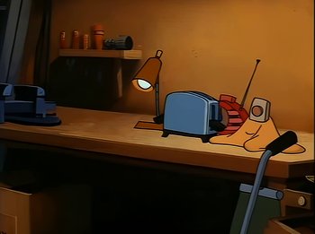 Movie still from “The Brave Little Toaster” (1987), directed by Jerry Rees – An illustration of a desk with a toaster and a lamp; Wide shot, High angle