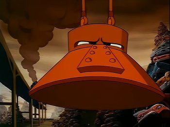 Movie still from “The Brave Little Toaster” (1987), directed by Jerry Rees – An animated picture of an orange object with a smoke stack in the background; Close Up shot, Low angle