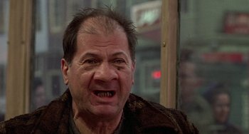 Movie still from “The Brink's Job” (1978), directed by William Friedkin – An older man with an angry look on his face; Close Up shot, Low angle