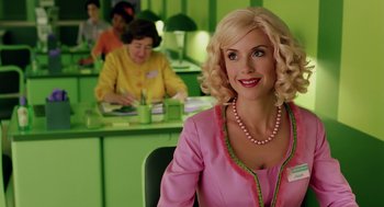 Movie still from “The Cat in the Hat” (2003), directed by Bo Welch – A woman sitting in a chair in front of other people; Medium shot, Over the shoulder angle