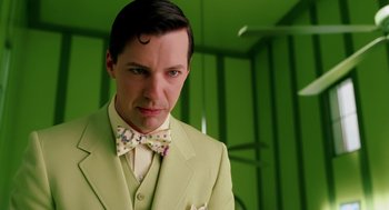 Movie still from “The Cat in the Hat” (2003), directed by Bo Welch – A man wearing a suit and bow tie; Close Up shot, Low angle