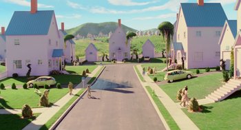 Movie still from “The Cat in the Hat” (2003), directed by Bo Welch – An animated scene of a street with houses on the side of the road; Extreme Wide shot, High angle
