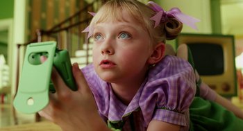 Movie still from “The Cat in the Hat” (2003), directed by Bo Welch – A little girl holding a green pepper in her hand; Close Up shot, High angle