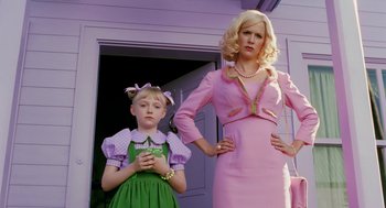 Movie still from “The Cat in the Hat” (2003), directed by Bo Welch – A woman and a little girl standing next to each other in front of a house; Medium shot, Low angle