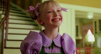 Movie still from “The Cat in the Hat” (2003), directed by Bo Welch – A little girl wearing a purple dress with a bow in her hair; Close Up shot, Low angle