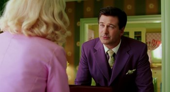Movie still from “The Cat in the Hat” (2003), directed by Bo Welch – A man in a purple suit and a woman in a pink dress; Medium shot, Over the shoulder angle