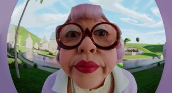 Movie still from “The Cat in the Hat” (2003), directed by Bo Welch – An old woman with a pink wig wearing glasses; Extreme Close Up shot, Low angle