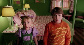 Movie still from “The Cat in the Hat” (2003), directed by Bo Welch – Two children standing next to each other near a bed; Close Up shot, High angle