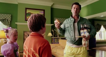 Movie still from “The Cat in the Hat” (2003), directed by Bo Welch – A man and a boy in a living room; Medium shot, Over the shoulder angle