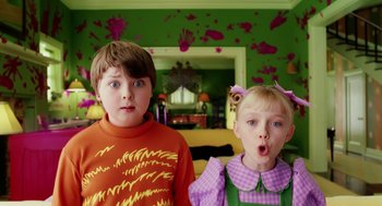 Movie still from “The Cat in the Hat” (2003), directed by Bo Welch – Two children standing next to each other in a room; Medium shot, High angle