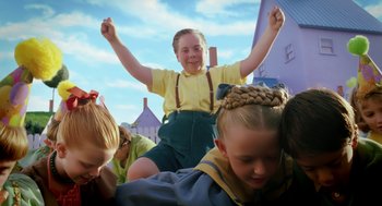 Movie still from “The Cat in the Hat” (2003), directed by Bo Welch – A group of children sitting on top of each other with their hands in the air; Medium shot, Low angle