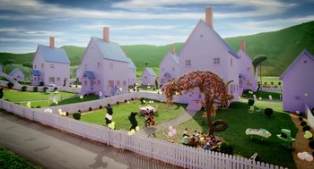 Movie still from “The Cat in the Hat” (2003), directed by Bo Welch – A group of people sitting in front of a house; Extreme Wide shot, High angle