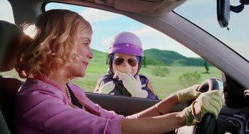 Movie still from “The Cat in the Hat” (2003), directed by Bo Welch – A woman driving a car with a child in the passenger seat; Medium shot, Over the shoulder angle