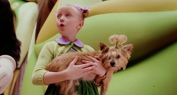 Movie still from “The Cat in the Hat” (2003), directed by Bo Welch – A little girl holding a small dog in her arms; Medium shot, Over the shoulder angle