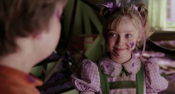 Movie still from “The Cat in the Hat” (2003), directed by Bo Welch – A young girl with a purple bow on her head; Close Up shot, Over the shoulder angle