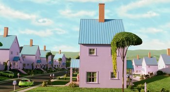 Movie still from “The Cat in the Hat” (2003), directed by Bo Welch – A purple house sitting on top of a lush green field; Extreme Wide shot, Low angle