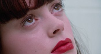 A woman's face with red lipstick